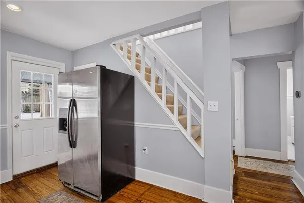 a view of entryway with stairs and wooden floor