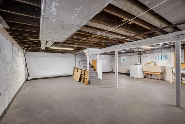 a view of a garage room with washing machine