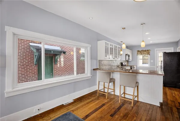 a kitchen with stainless steel appliances granite countertop a stove and a refrigerator