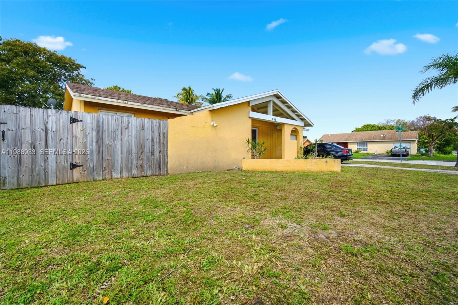 841 Southwest 55th Avenue Margate, FL 33068 - Photo 3 of 26 a house view with a garden space