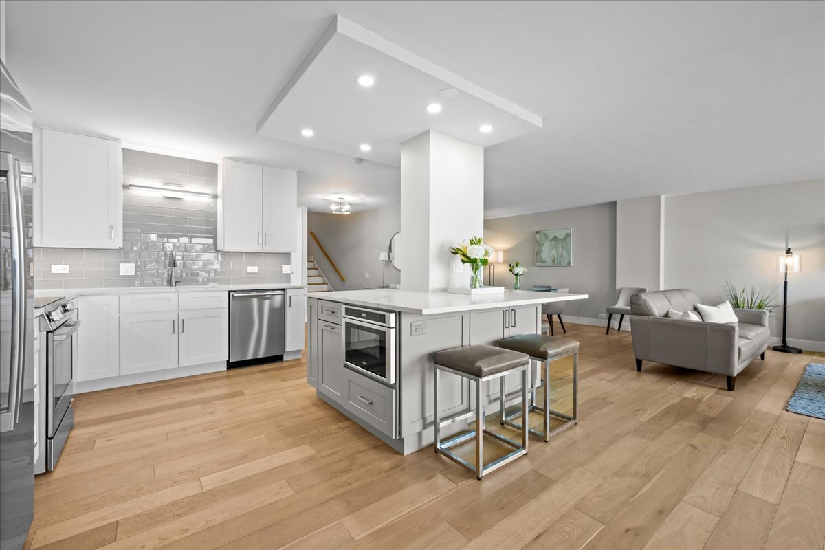 1500 Sheridan Road, Unit 3I Wilmette, IL 60091 - Photo 4 of 37 a kitchen with stainless steel appliances kitchen island granite countertop a stove a sink and white cabinets