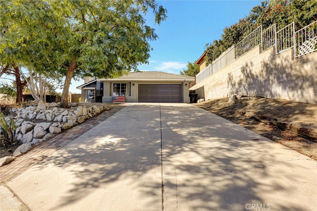 144 Kruse Street Perris, CA 92570 - Photo 1 of 1 a front view of a house with a yard