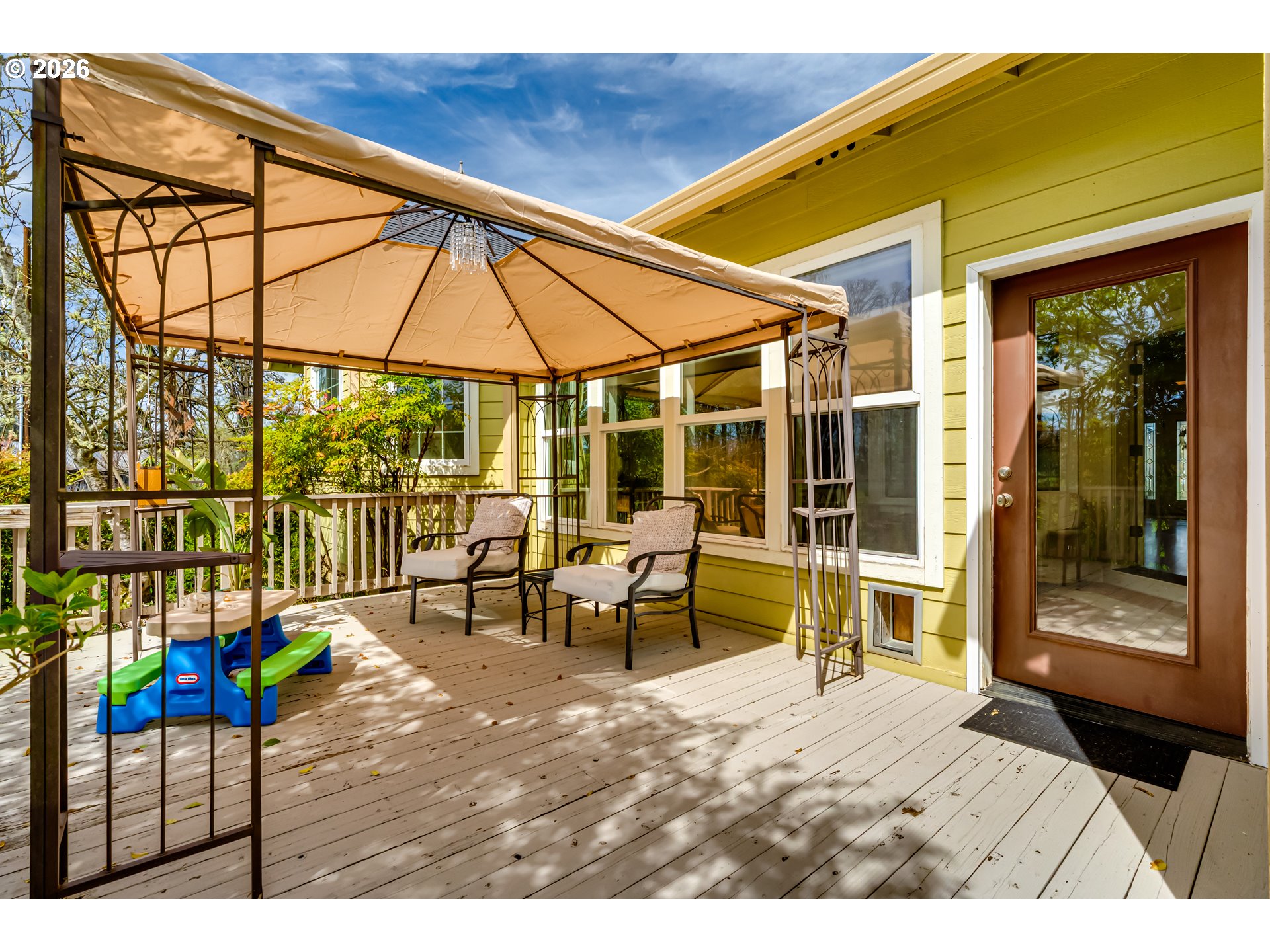 34386 Mathews Road Eugene, OR 97405 - Photo 48 of 48 a view of a patio with table and chairs under an umbrella