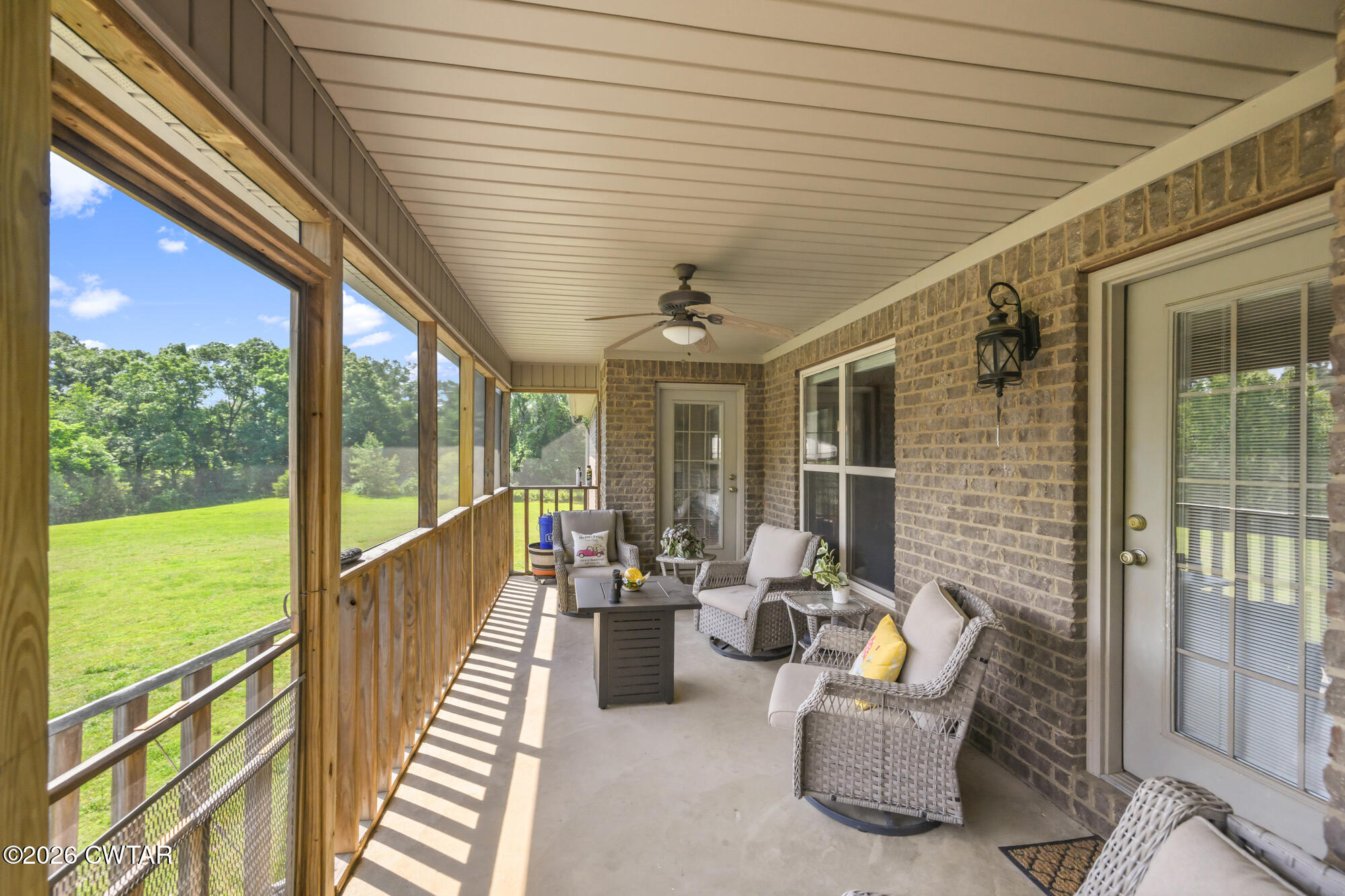 492 Joe Horton Road Lexington, TN 38351 - Photo 21 of 49 a balcony with furniture and a garden