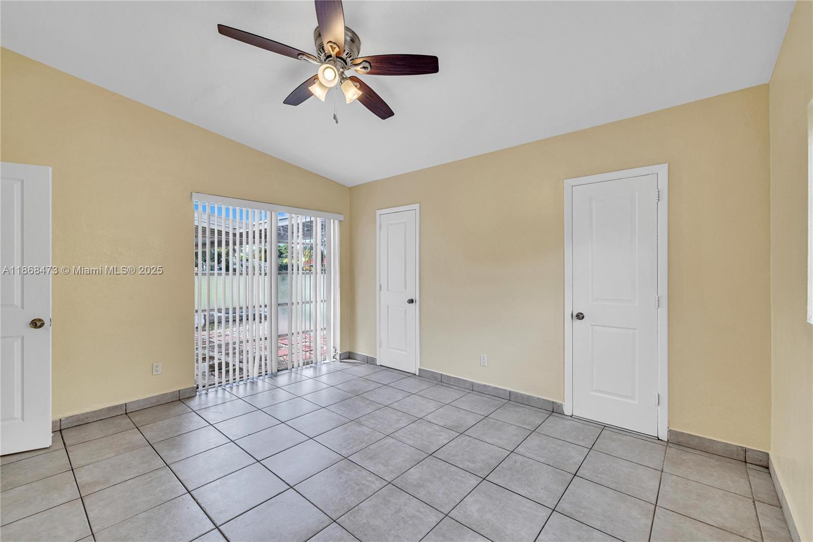 650 Northeast 178th Street Miami, FL 33162 - Photo 19 of 37 a view of an empty room with a window