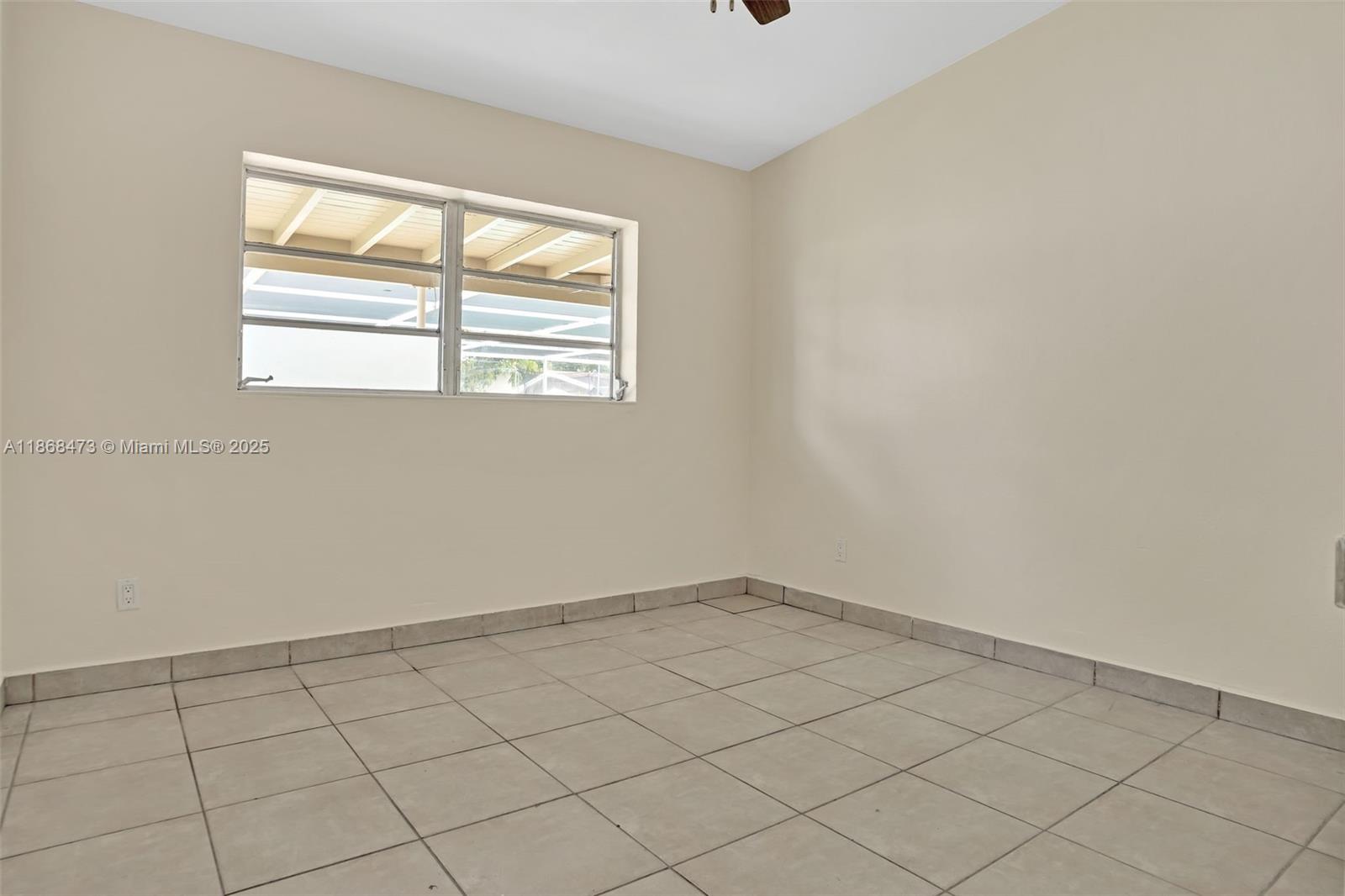 650 Northeast 178th Street Miami, FL 33162 - Photo 23 of 37 an empty room with windows