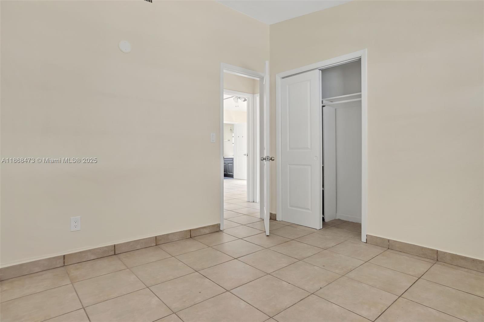650 Northeast 178th Street Miami, FL 33162 - Photo 24 of 37 a view of an empty room and closet
