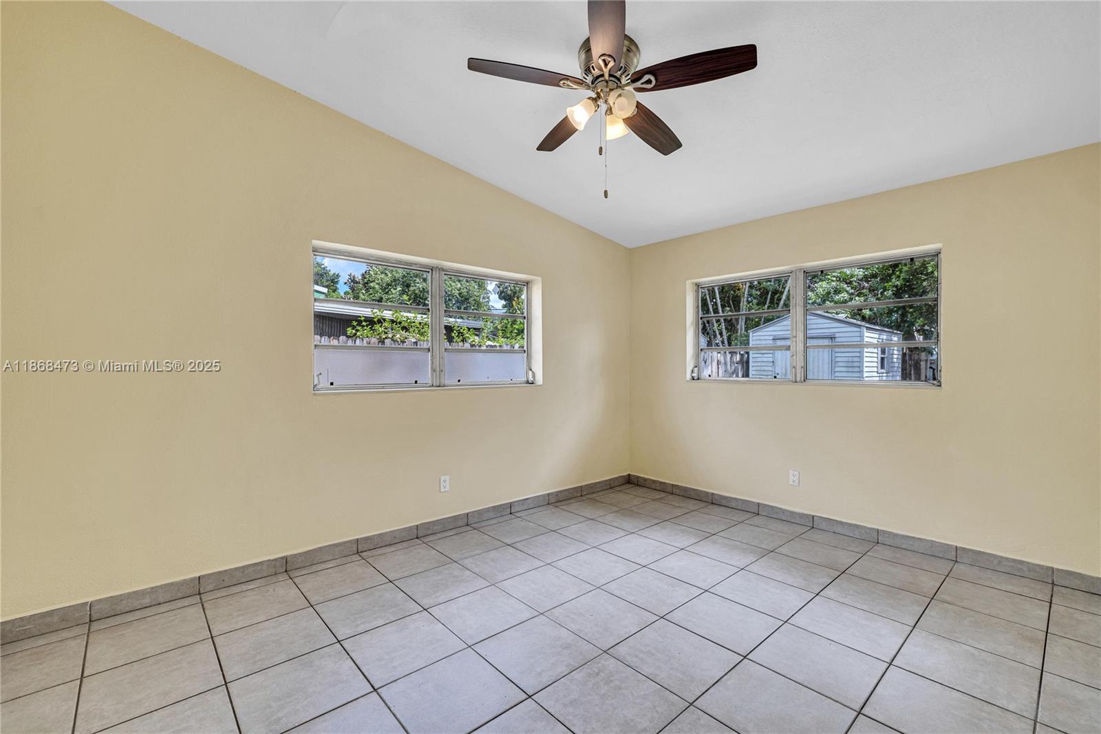 650 Northeast 178th Street Miami, FL 33162 - Photo 28 of 37 a view of an empty room with a window
