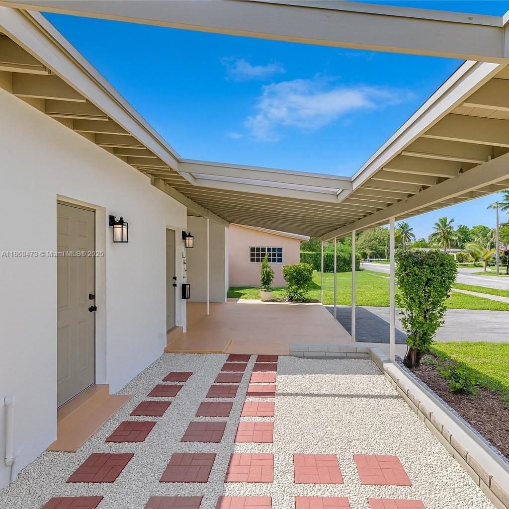 650 Northeast 178th Street Miami, FL 33162 - Photo 34 of 37 a view of a house with a yard