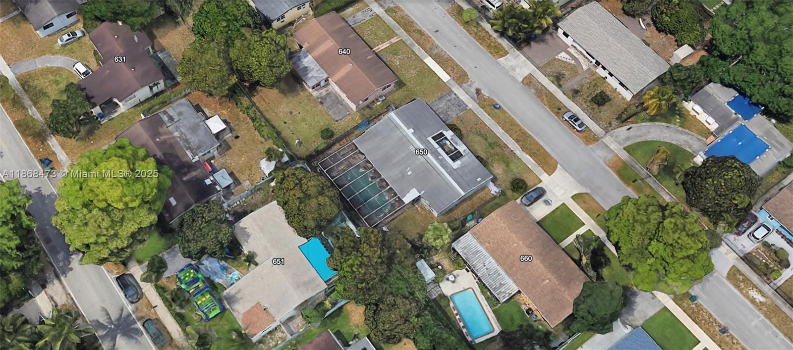 650 Northeast 178th Street Miami, FL 33162 - Photo 37 of 37 an aerial view of a residential apartment building with plants