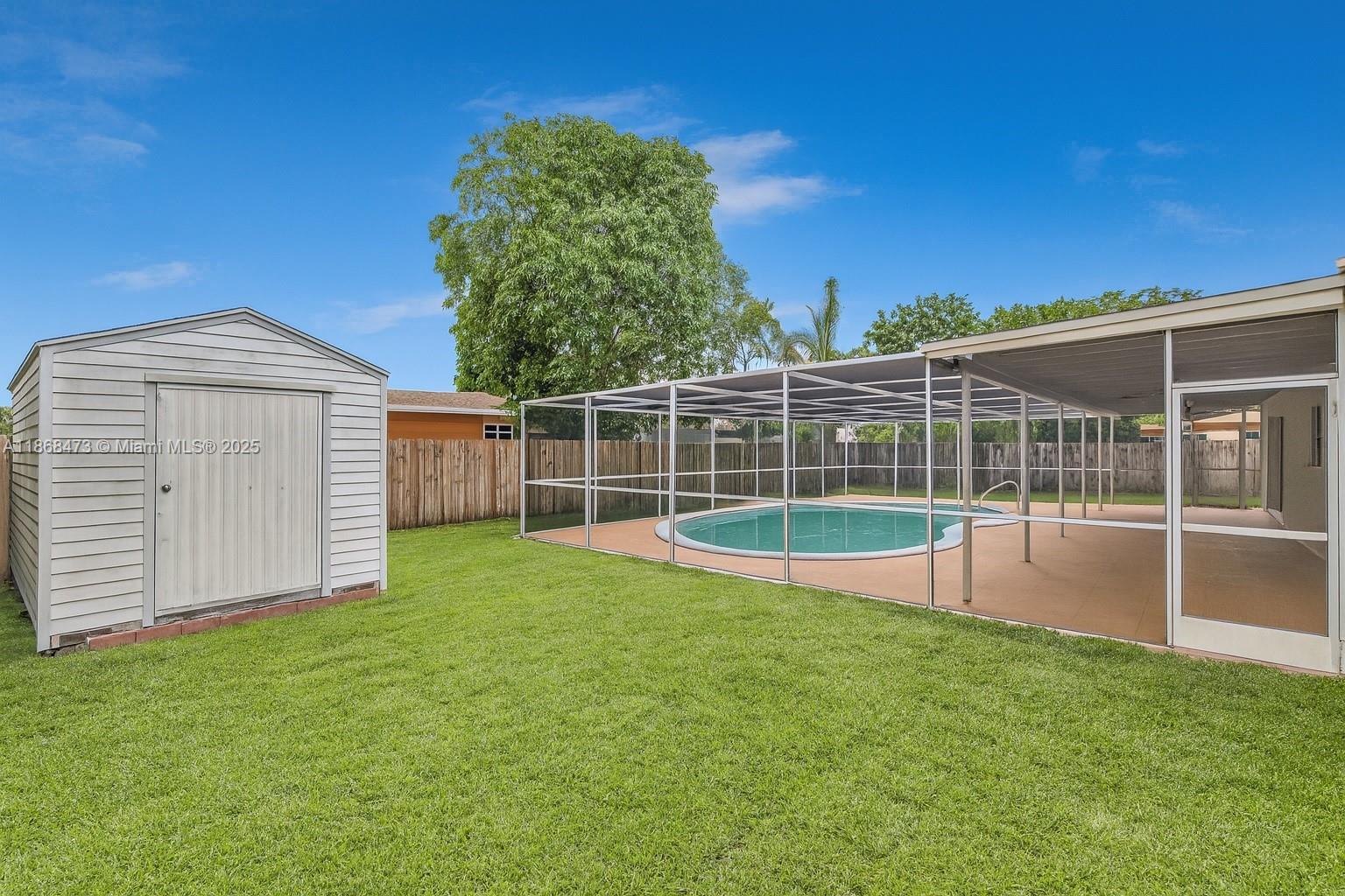 650 Northeast 178th Street Miami, FL 33162 - Photo 6 of 37 a view of a backyard with a small cabin