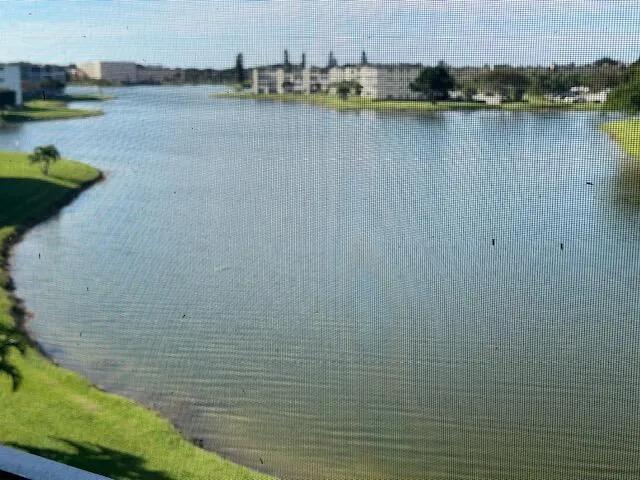 a view of a lake with houses in the back