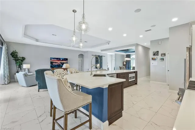 a large kitchen with a table and chairs