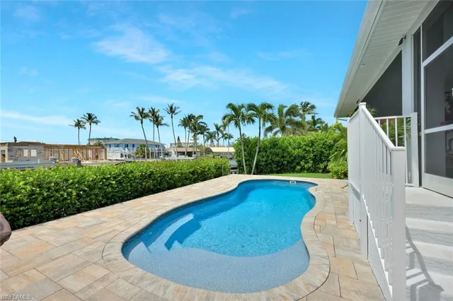 a view of swimming pool from a balcony