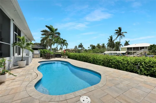 a view of a swimming pool with a patio
