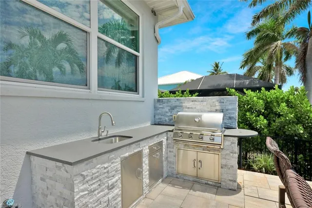 a stove top oven sitting inside of a kitchen