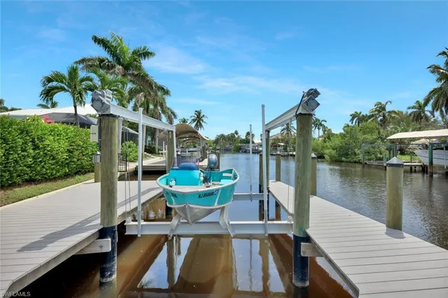 a balcony with furniture and a lake view