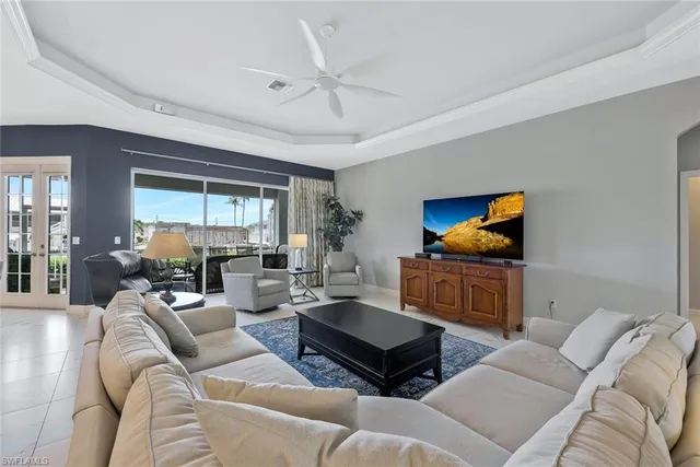 a living room with furniture a rug and a flat screen tv