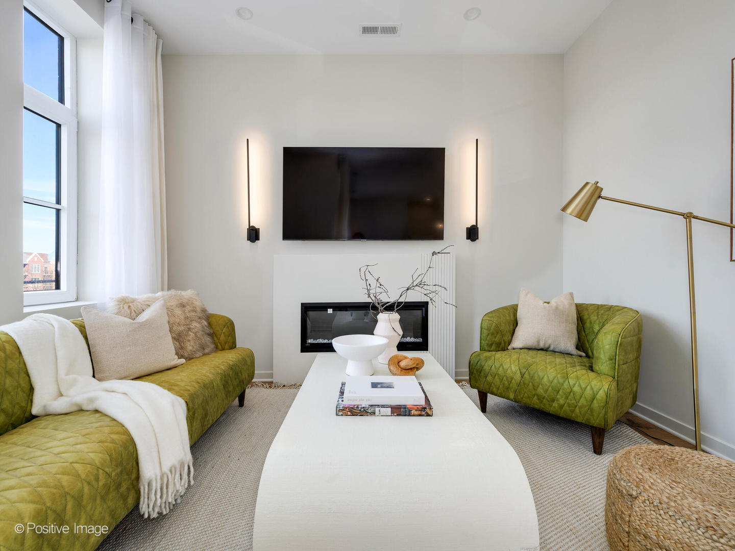 11 West Prospect Avenue, Unit 515 Mount Prospect, IL 60056 - Photo 11 of 43 a living room with furniture a flat screen tv and a fireplace
