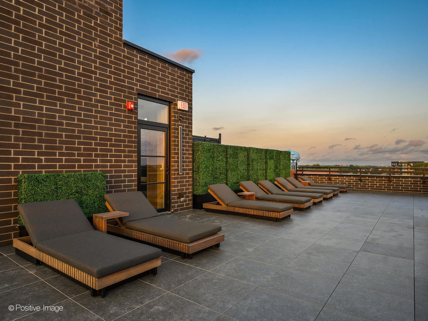 11 West Prospect Avenue, Unit 515 Mount Prospect, IL 60056 - Photo 35 of 43 a backyard of a house with barbeque oven table and chairs