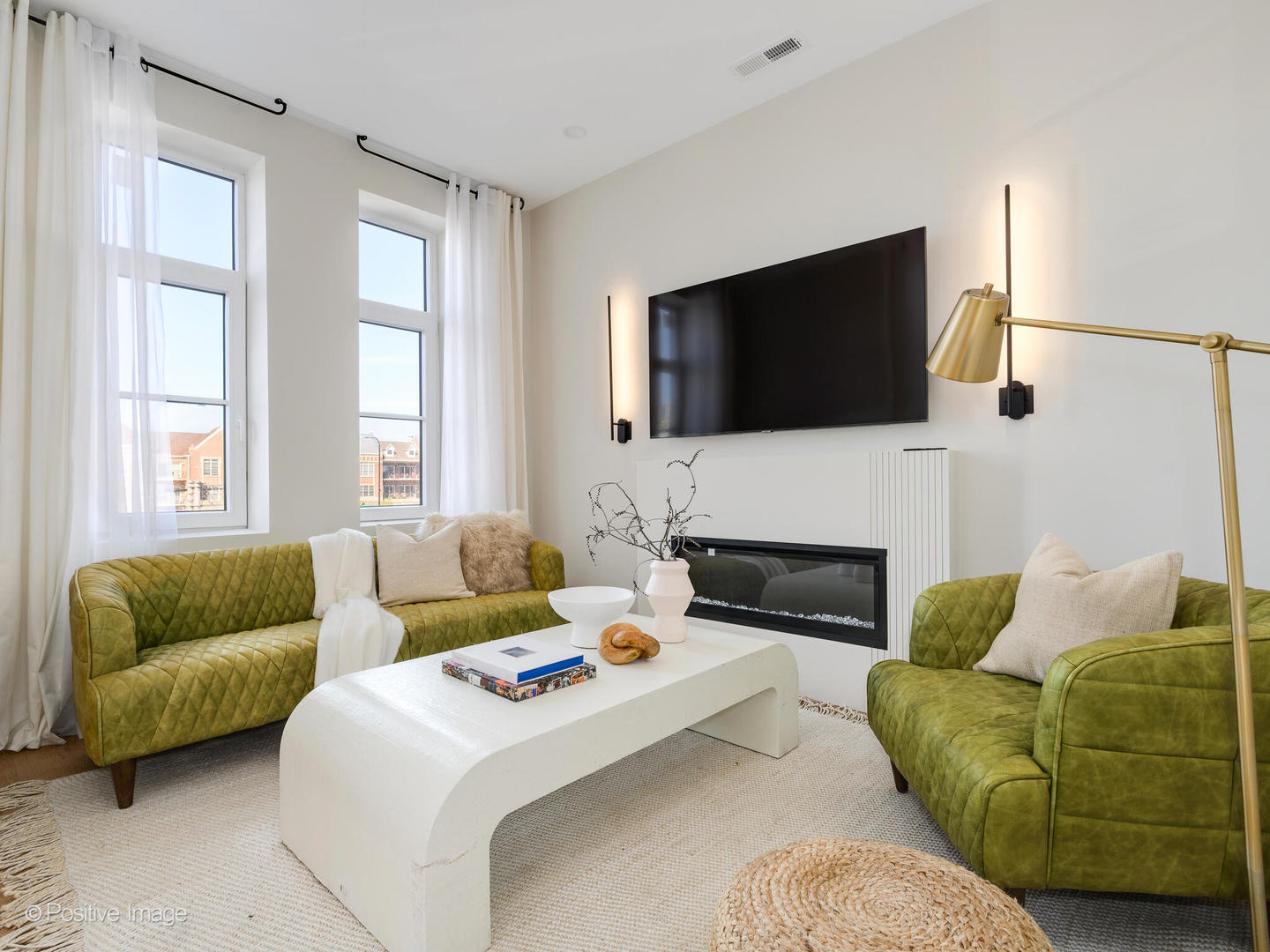 11 West Prospect Avenue, Unit 515 Mount Prospect, IL 60056 - Photo 10 of 43 a living room with fireplace furniture and a flat screen tv