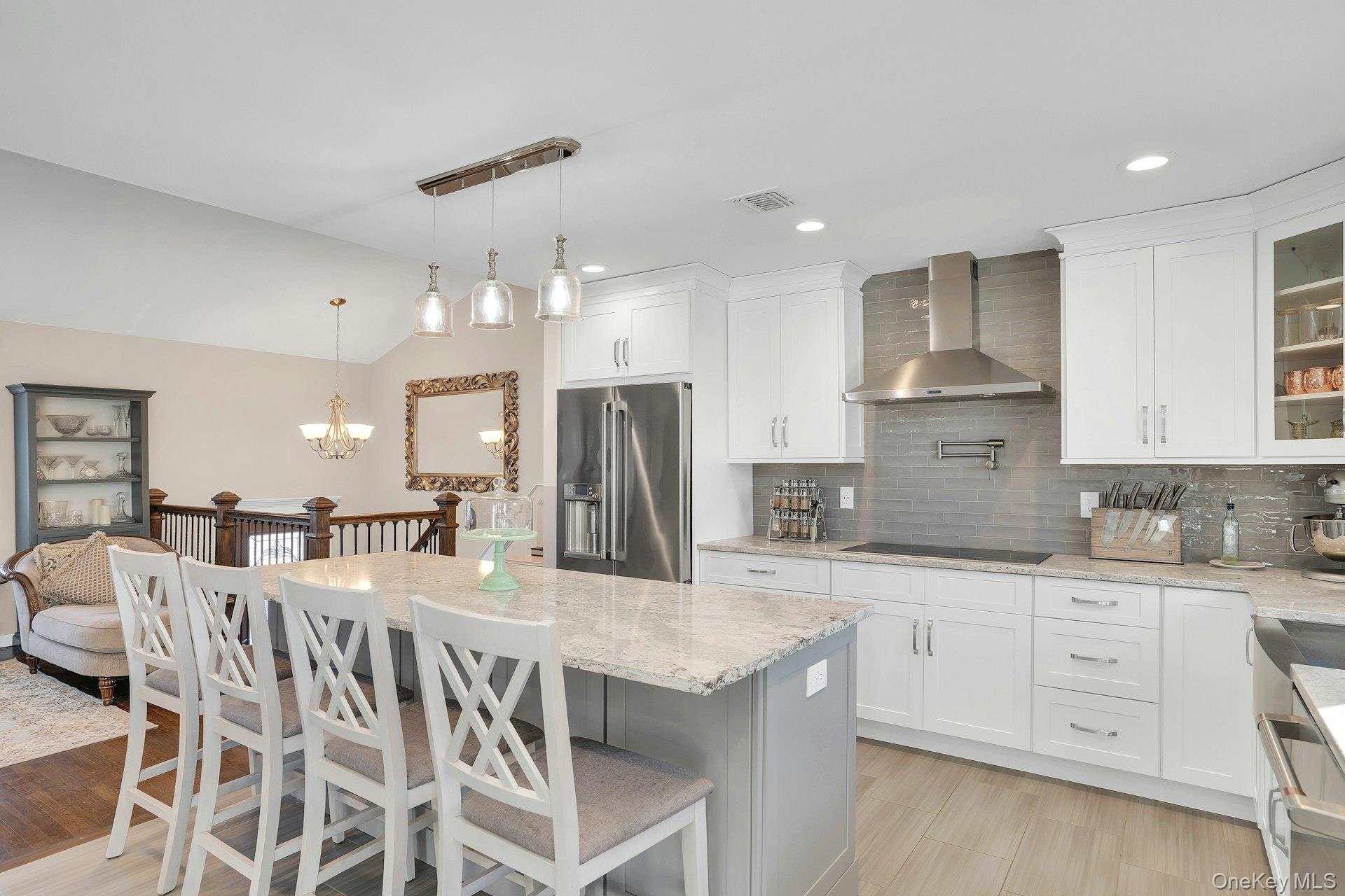 108 Hayrick Lane Commack, NY 11725 - Photo 13 of 50 a kitchen with stainless steel appliances kitchen island granite countertop a sink and cabinets