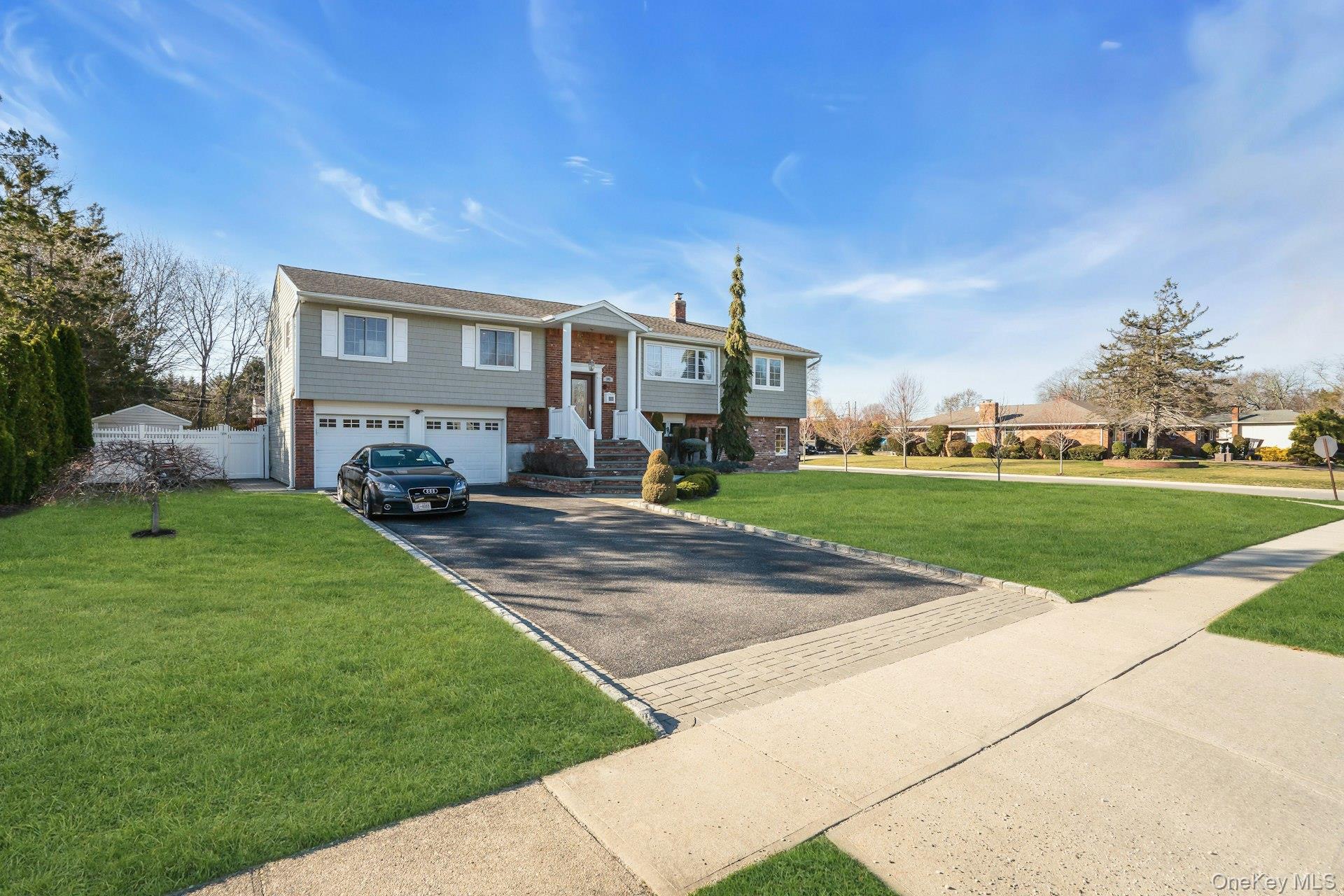 108 Hayrick Lane Commack, NY 11725 - Photo 2 of 50 a front view of a house with garden