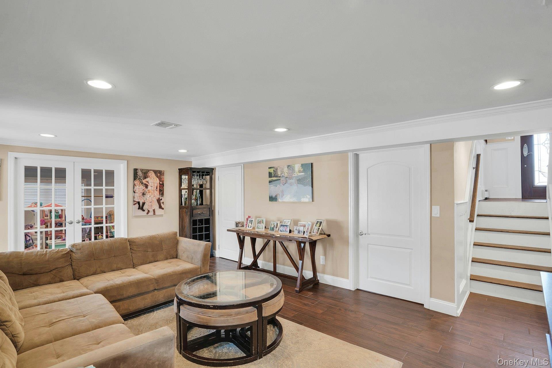 108 Hayrick Lane Commack, NY 11725 - Photo 21 of 50 a living room with furniture a dining table and a large window