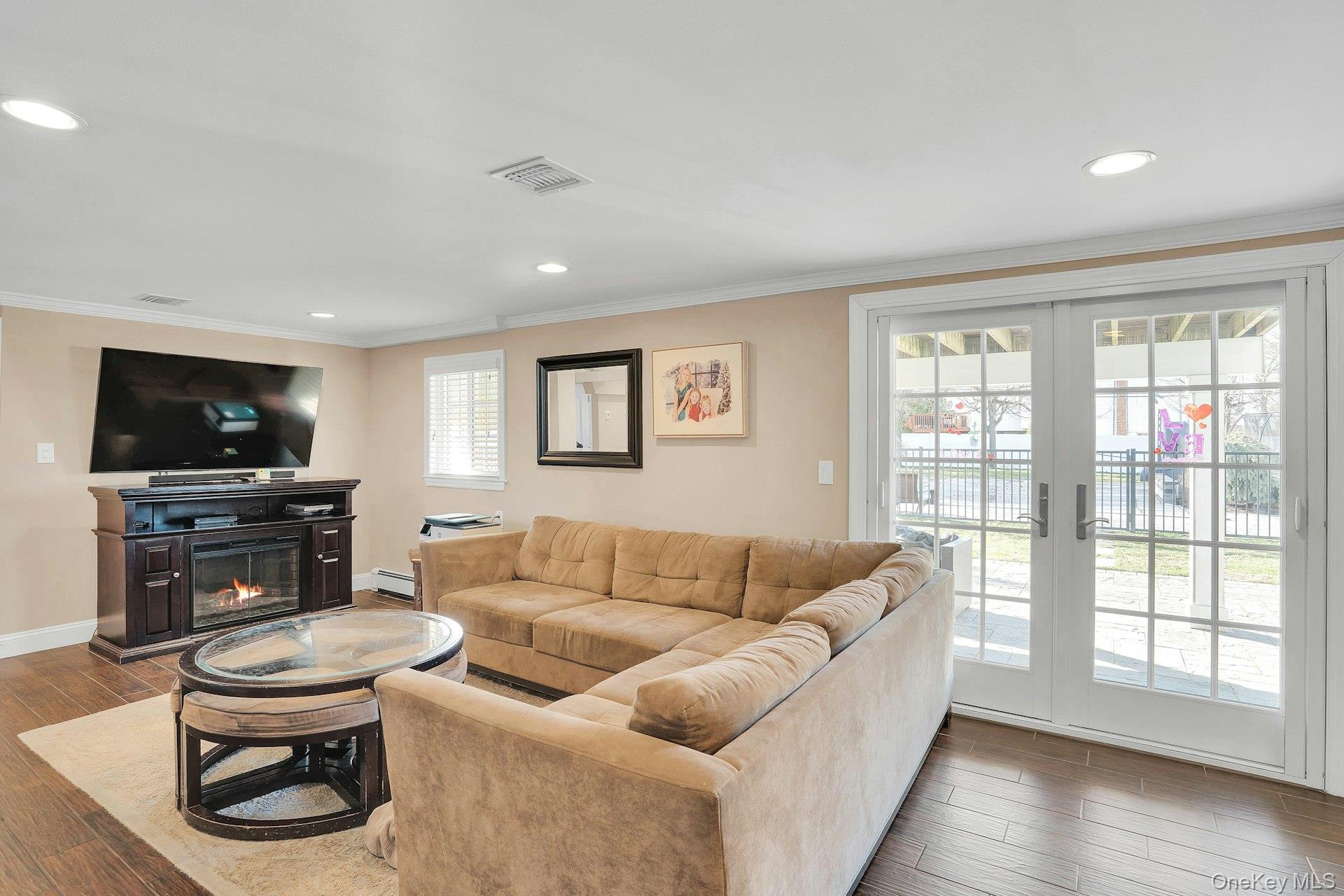 108 Hayrick Lane Commack, NY 11725 - Photo 22 of 50 a living room with furniture and a flat screen tv