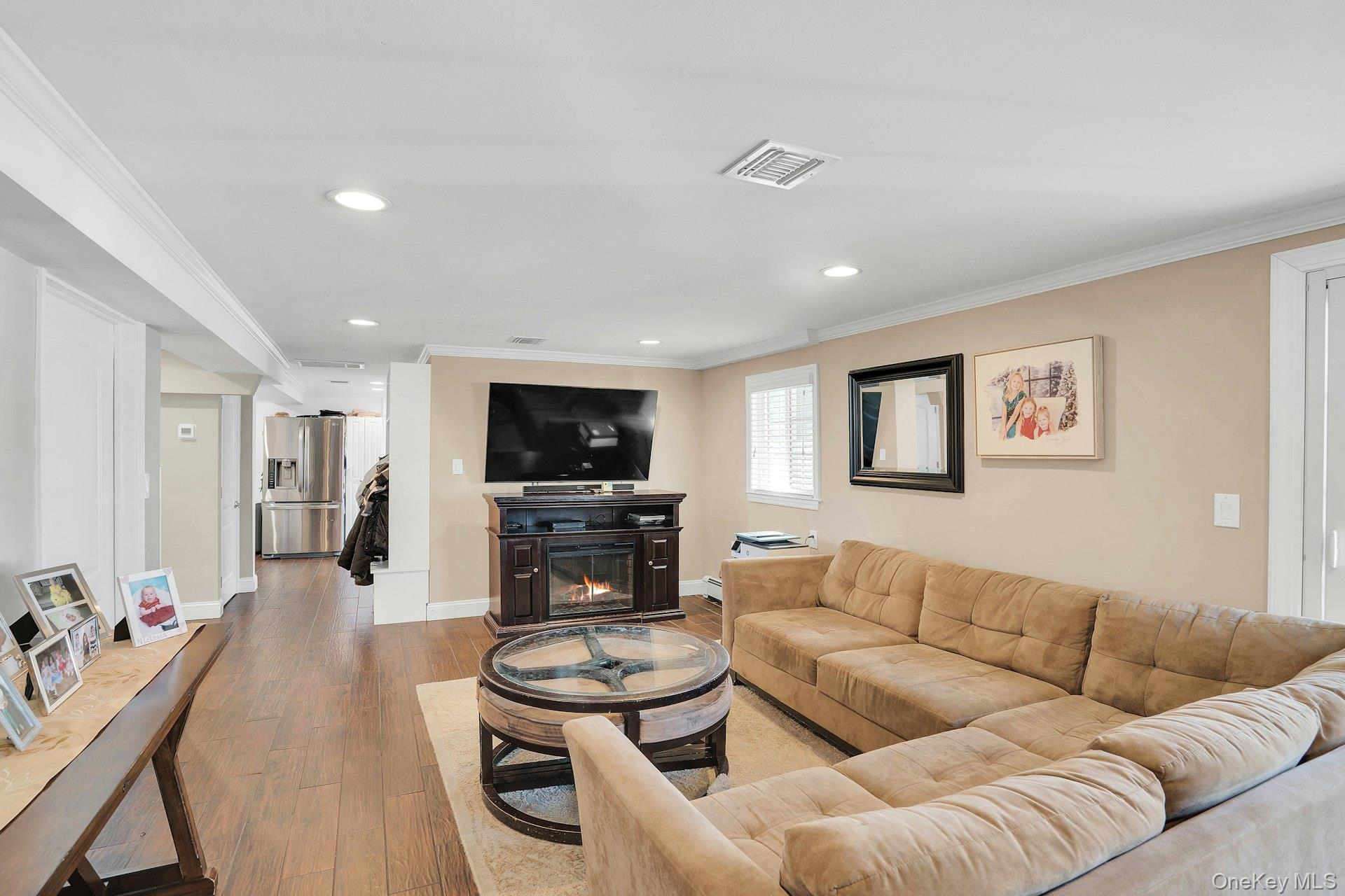 108 Hayrick Lane Commack, NY 11725 - Photo 23 of 50 a living room with furniture and a flat screen tv