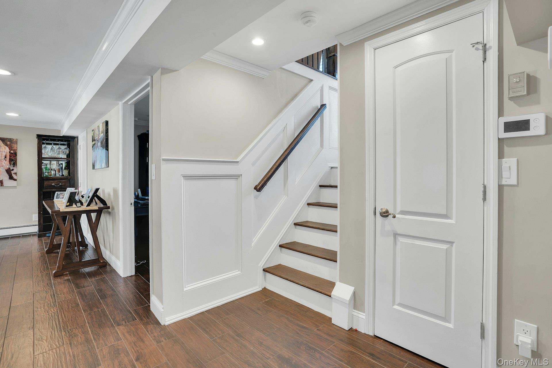 108 Hayrick Lane Commack, NY 11725 - Photo 25 of 50 a view of entryway with wooden floor and stairs