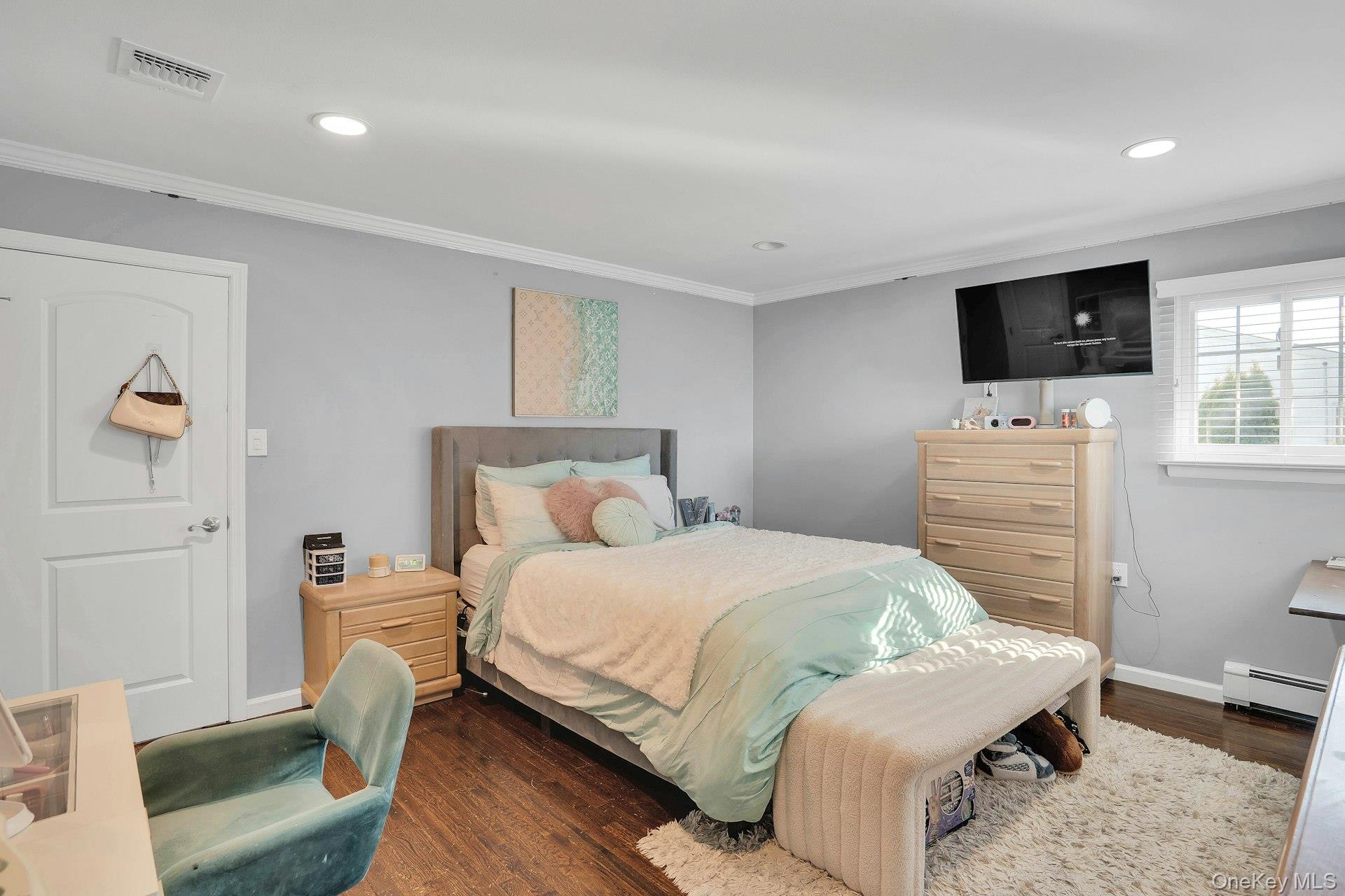 108 Hayrick Lane Commack, NY 11725 - Photo 28 of 50 a bedroom with a bed and a television
