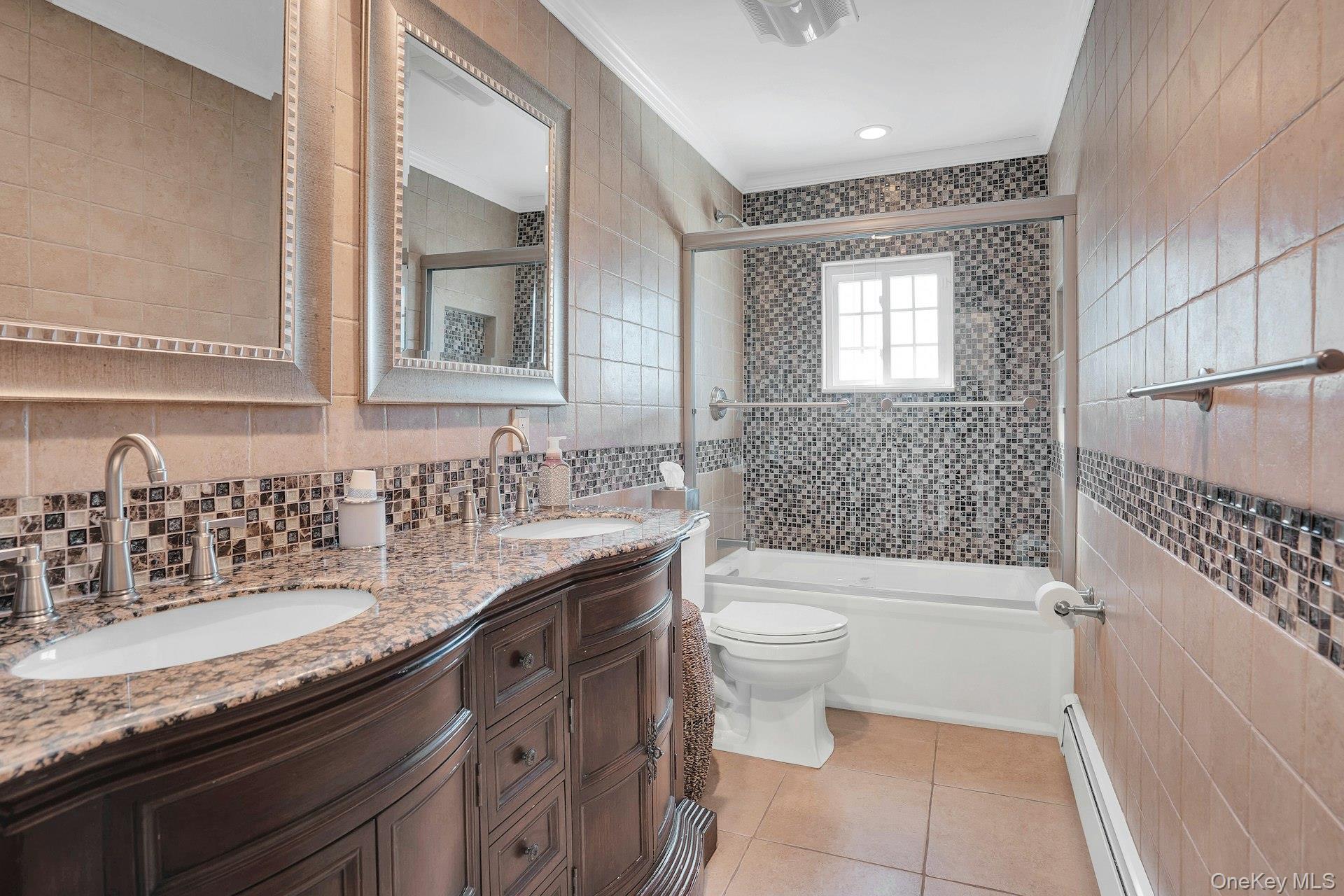 108 Hayrick Lane Commack, NY 11725 - Photo 29 of 50 a bathroom with a granite countertop sink a toilet a mirror and bathtub