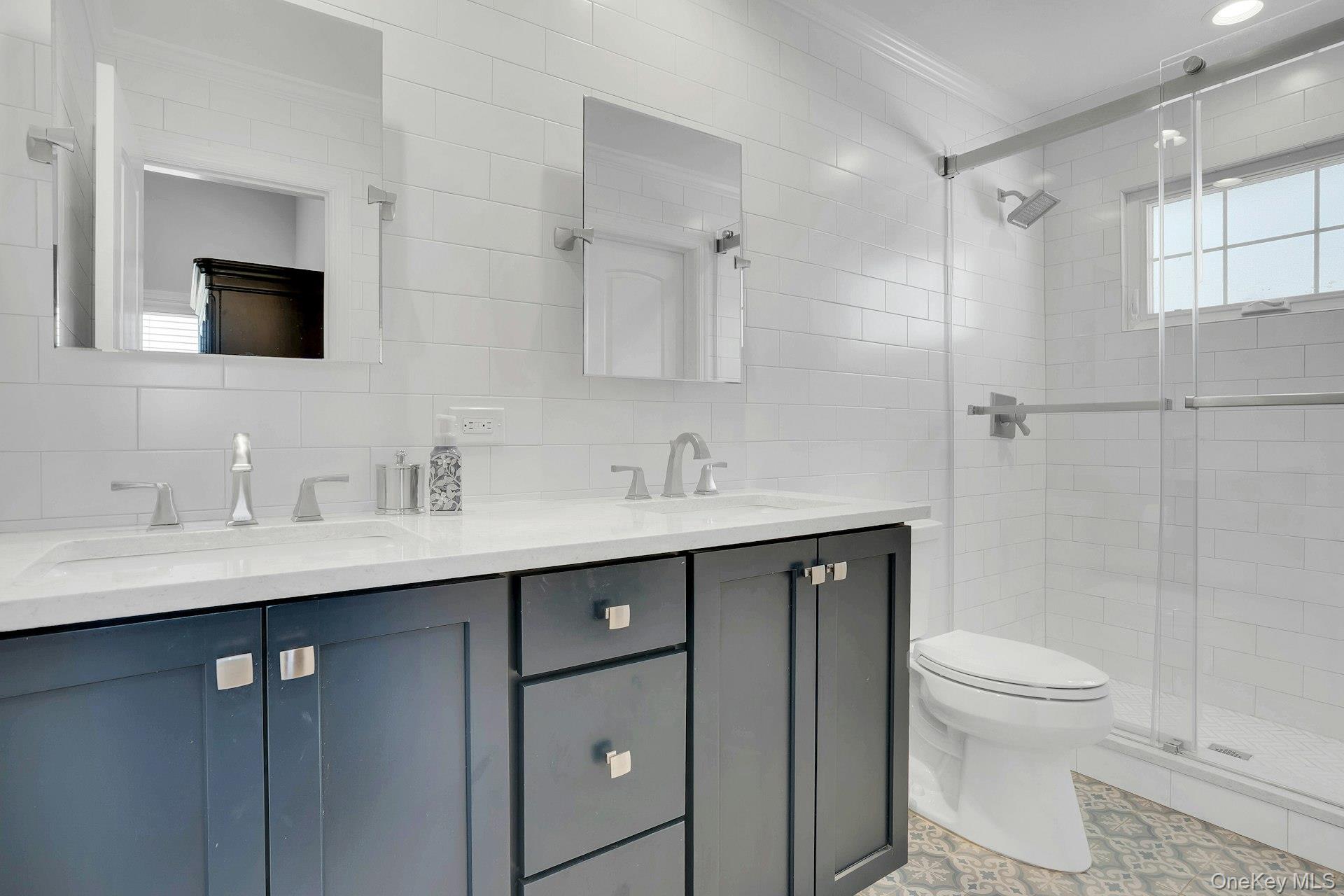 108 Hayrick Lane Commack, NY 11725 - Photo 30 of 50 a bathroom with a sink toilet double vanity and shower