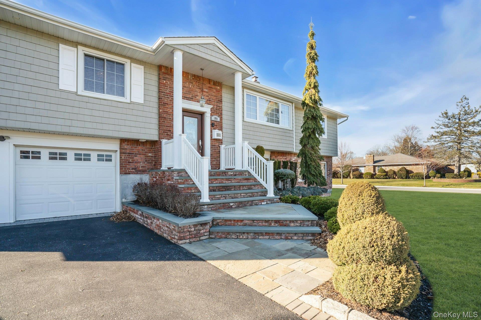 108 Hayrick Lane Commack, NY 11725 - Photo 3 of 50 a front view of a house with garden