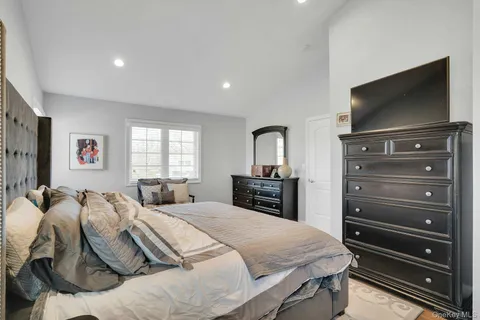 a bedroom with a bed and couch