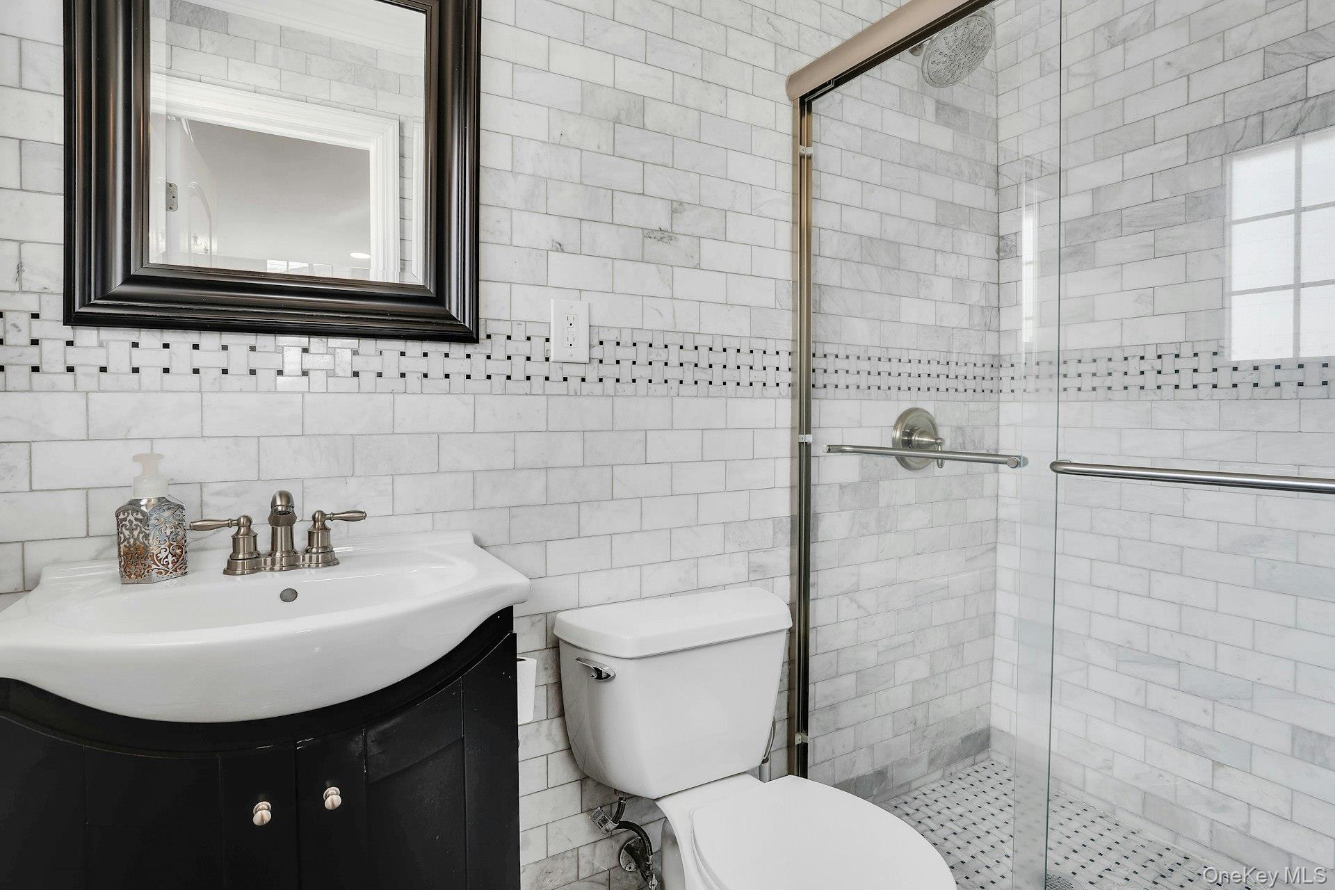 108 Hayrick Lane Commack, NY 11725 - Photo 37 of 50 a bathroom with a toilet a sink and mirror