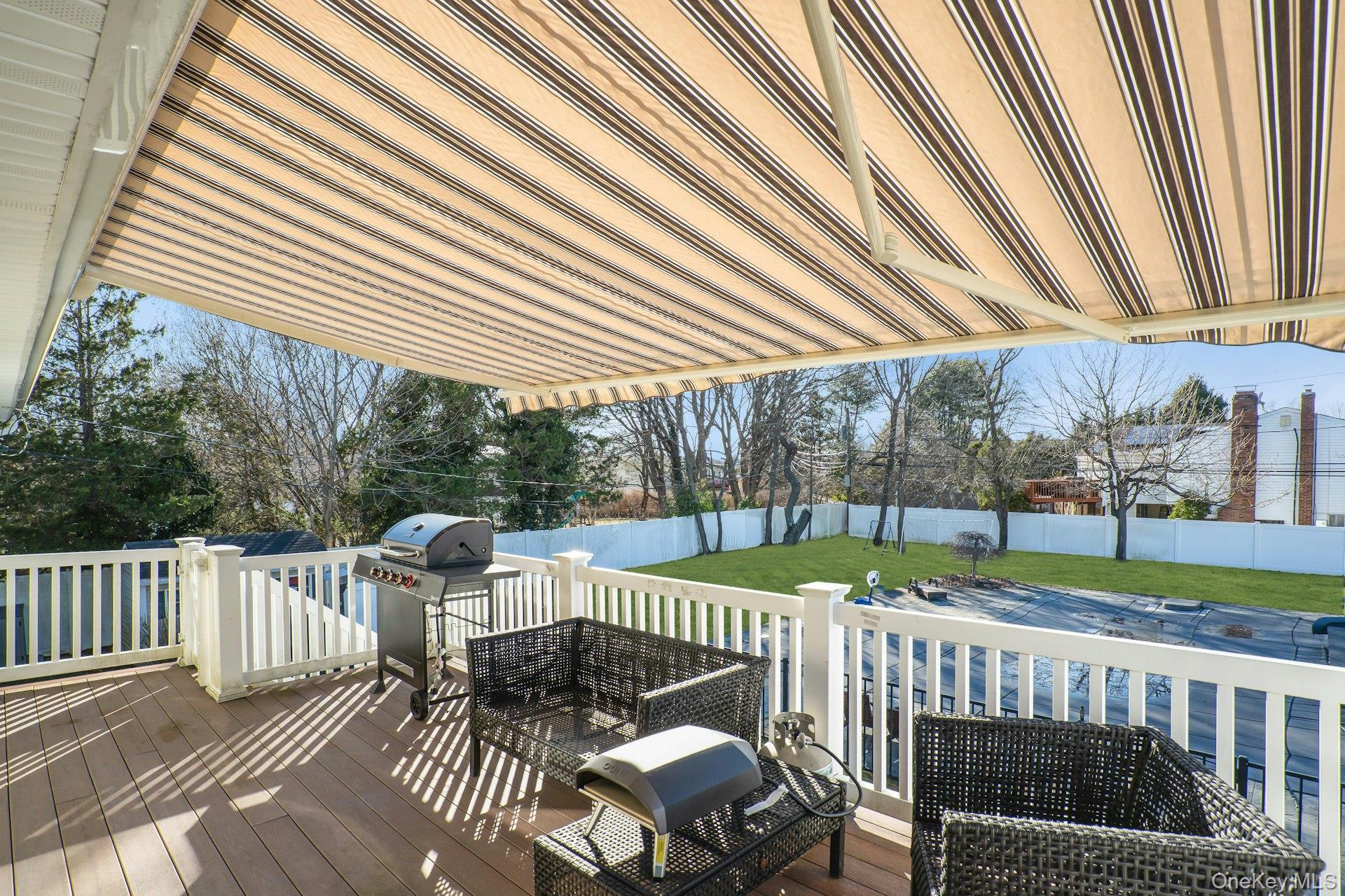 108 Hayrick Lane Commack, NY 11725 - Photo 40 of 50 a view of a patio with a table chairs and backyard