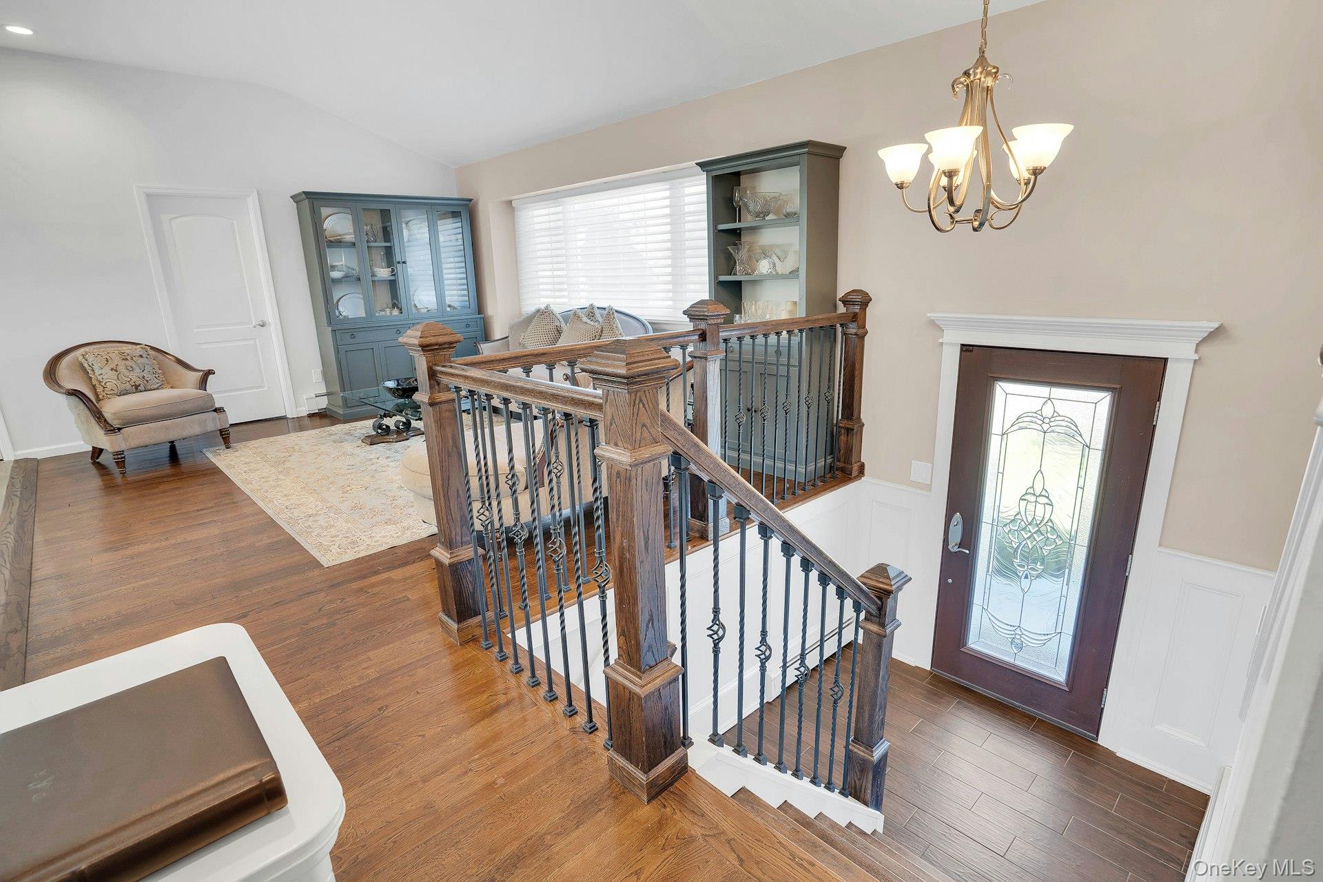 108 Hayrick Lane Commack, NY 11725 - Photo 4 of 50 a view of a dining room with furniture wooden floor and chandelier