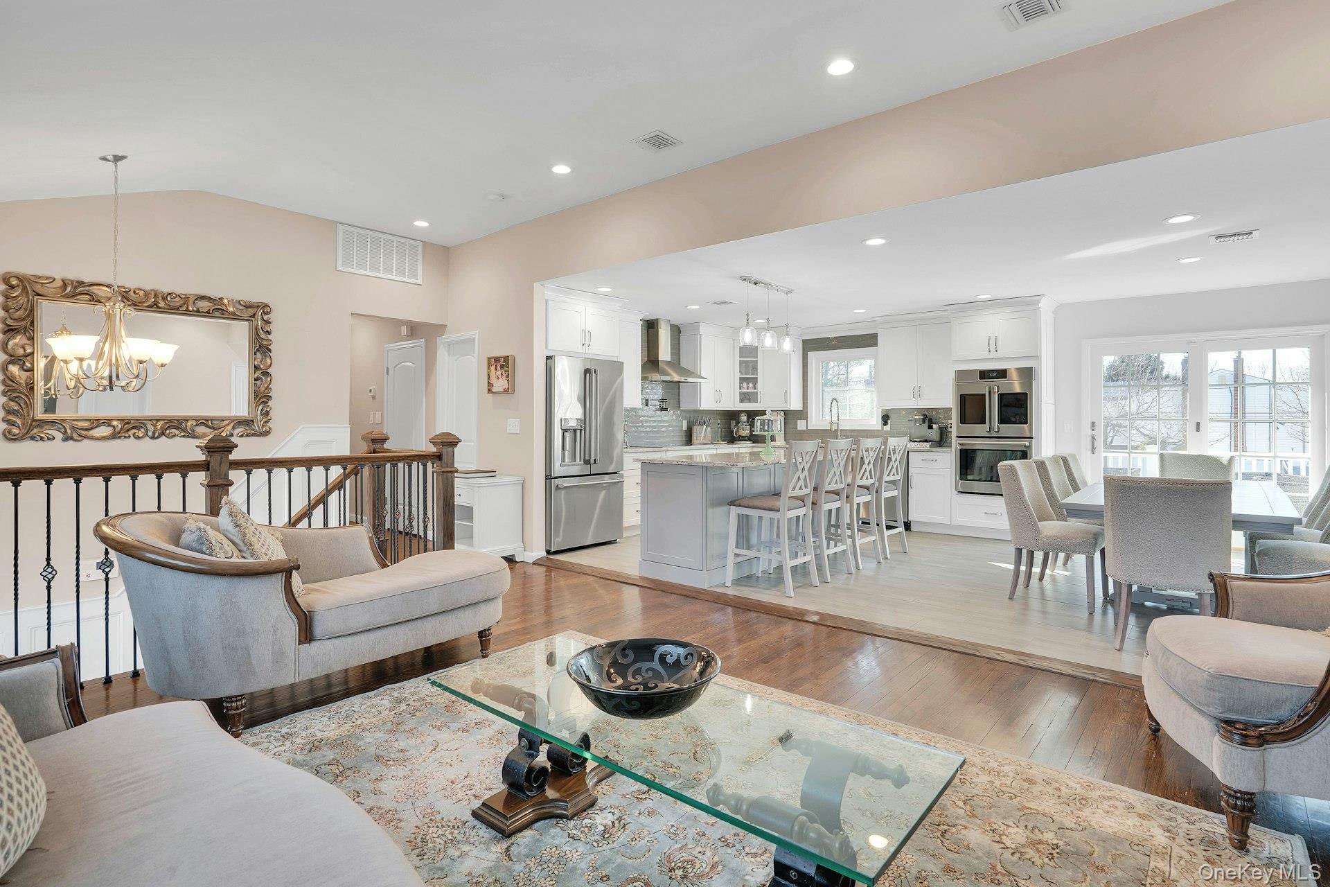 108 Hayrick Lane Commack, NY 11725 - Photo 5 of 50 a living room with lots of furniture and a view of kitchen