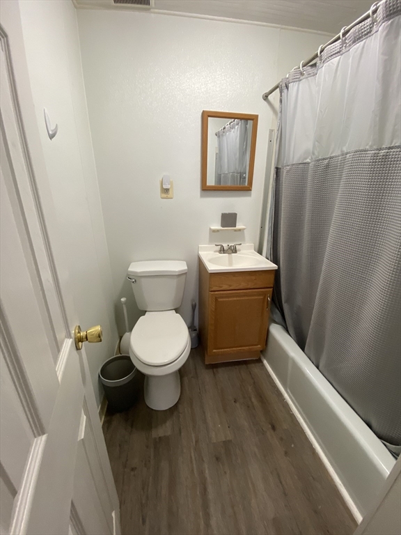 14 Monument Square, Unit 11 Boston, MA 02129 - Photo 4 of 4 a bathroom with a toilet a sink and a shower