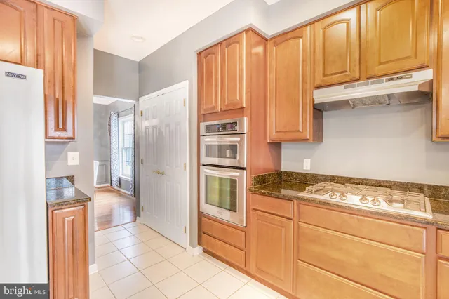a bedroom with furniture and a fireplace
