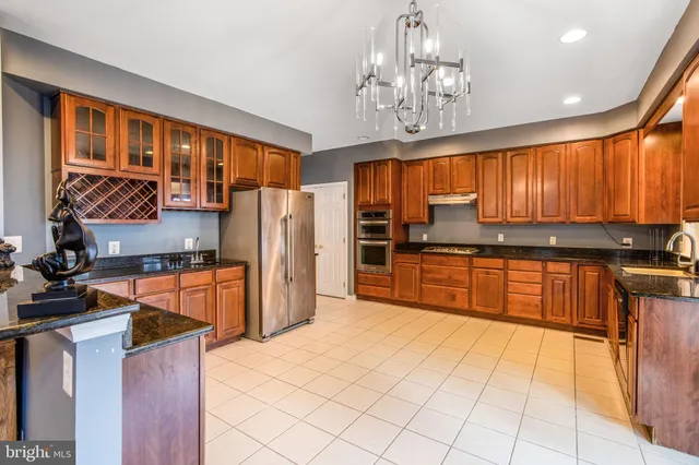 a bedroom with furniture and a chandelier
