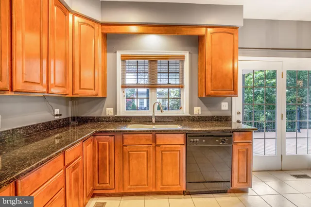 a bath tub sitting in a bathroom next to a window