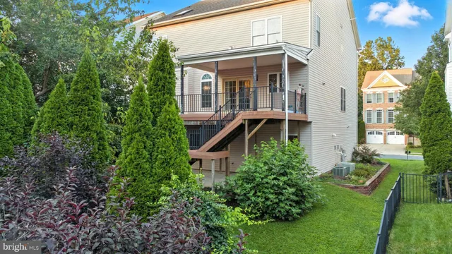 an aerial view of a house with a backyard