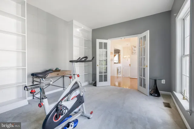 aerial view of a house with a yard and potted plants