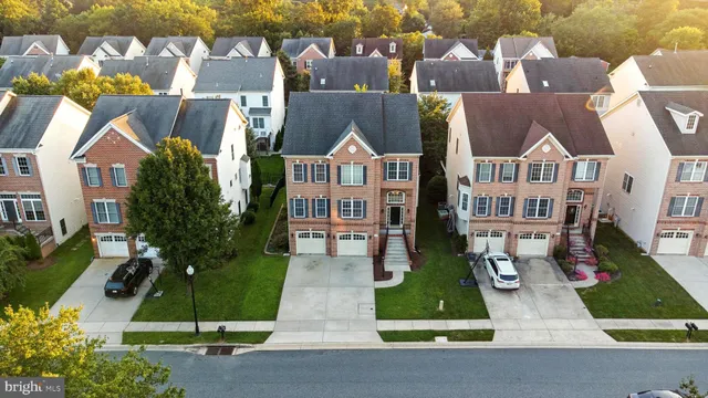 a kitchen with stainless steel appliances granite countertop a refrigerator stove top oven a sink and dishwasher