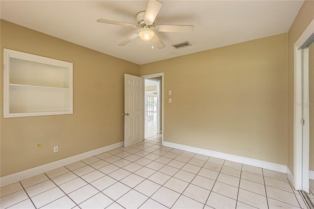 18129 Crawley Road, Unit 1 Odessa, FL 33556 - Photo 23 of 51 a view of an empty room and window
