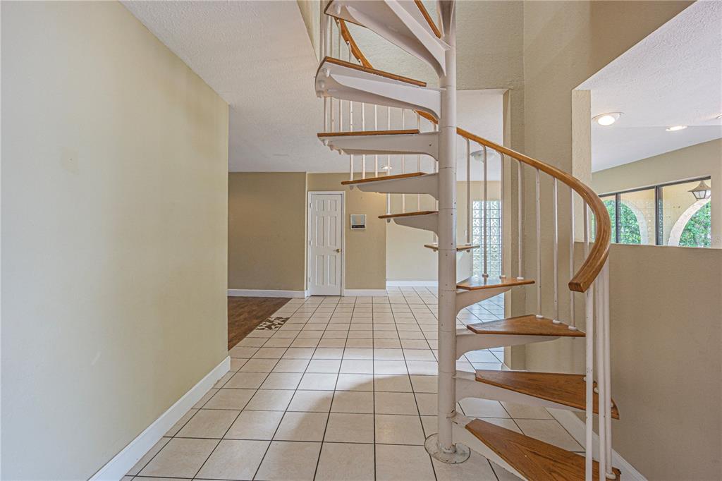 18129 Crawley Road, Unit 1 Odessa, FL 33556 - Photo 32 of 51 a view of entryway with wooden floor