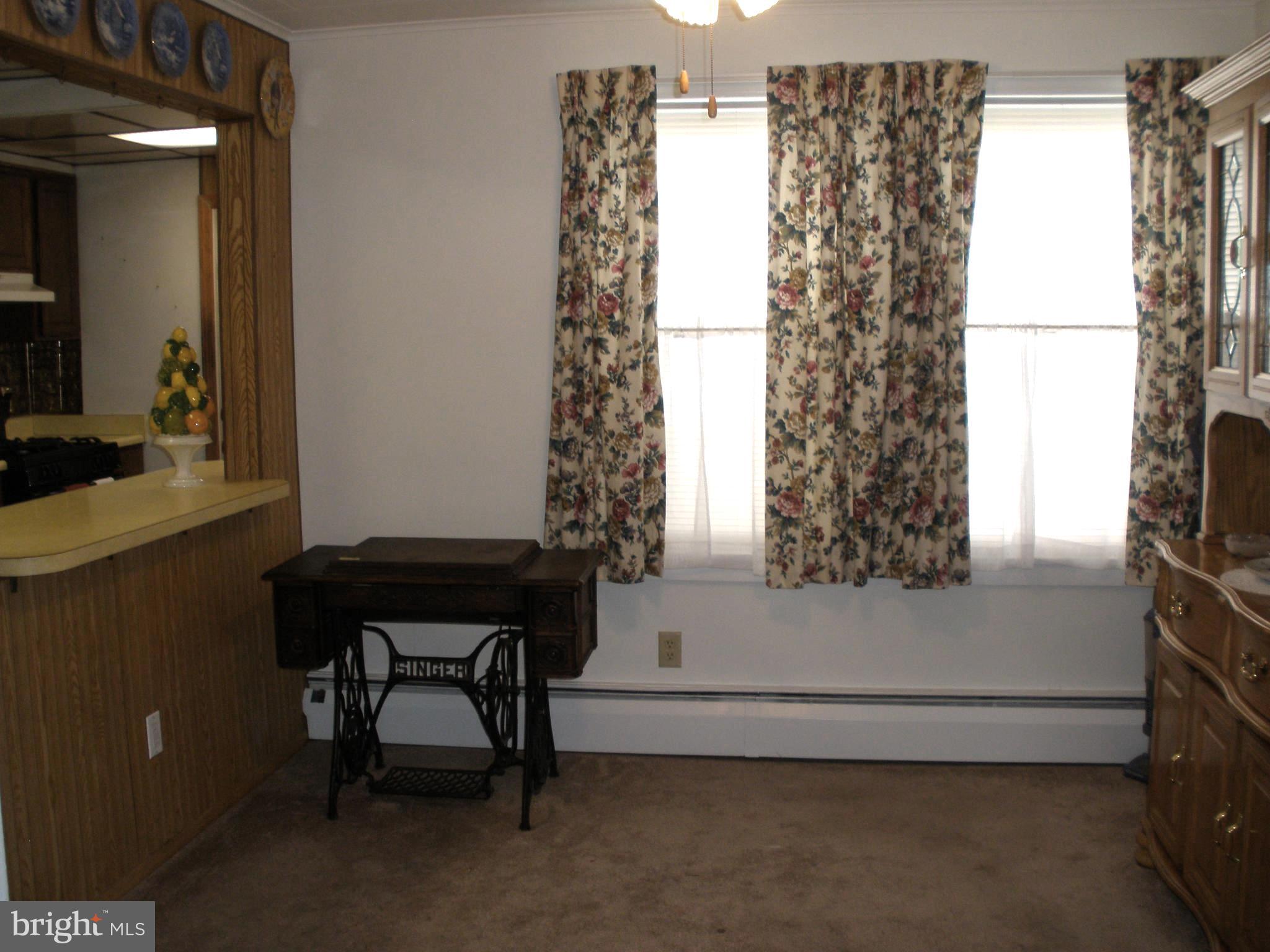 38 Kinship Road Baltimore, MD 21222 - Photo 11 of 38 a bathroom with a bathtub and a window